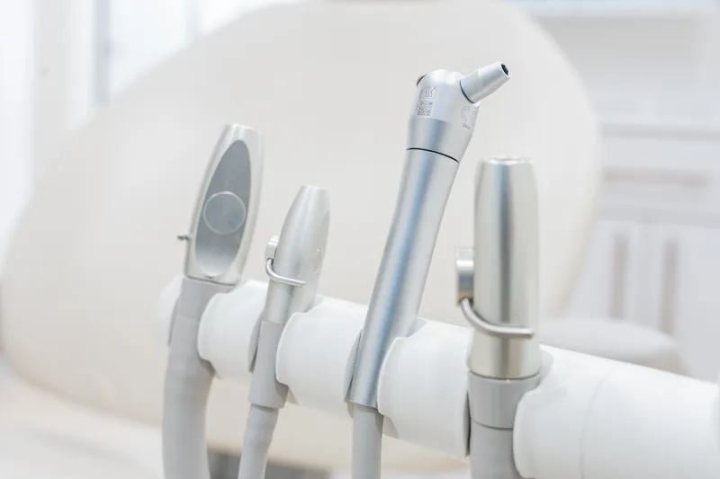 A detail of the practice interior showing oak cabinetry and clinical equipment
